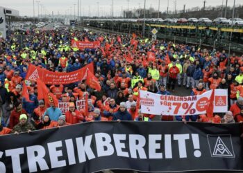 Volkswagen workers walk out on strike as German auto industry is engulfed in crisis