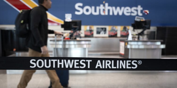 Southwest Airlines will start charging for a checked bag tomorrow Southwest Airlines will start charging for a checked bag tomorrow