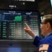 Wall Street tumbles, then climbs, as trading begins and volatility continues on Friday Wall Street tumbles, then climbs, as trading begins and volatility continues on Friday