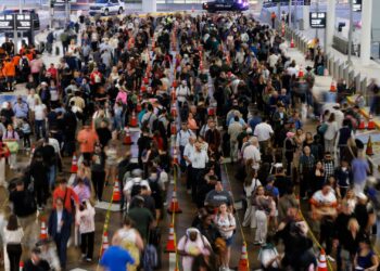 Pricy airfare, airport chaos test travelers’ willingness to fly this year