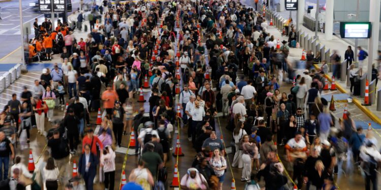 Pricy airfare, airport chaos test travelers’ willingness to fly this year