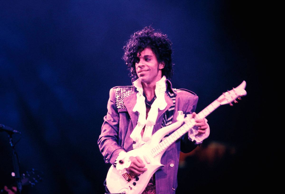 Prince's white ruffled 'Purple Rain' shirt and iconic blue high-heeled boots that show his 'influence and legacy' in fashion are being auctioned 1 a718f6ca GettyImages 86103158
