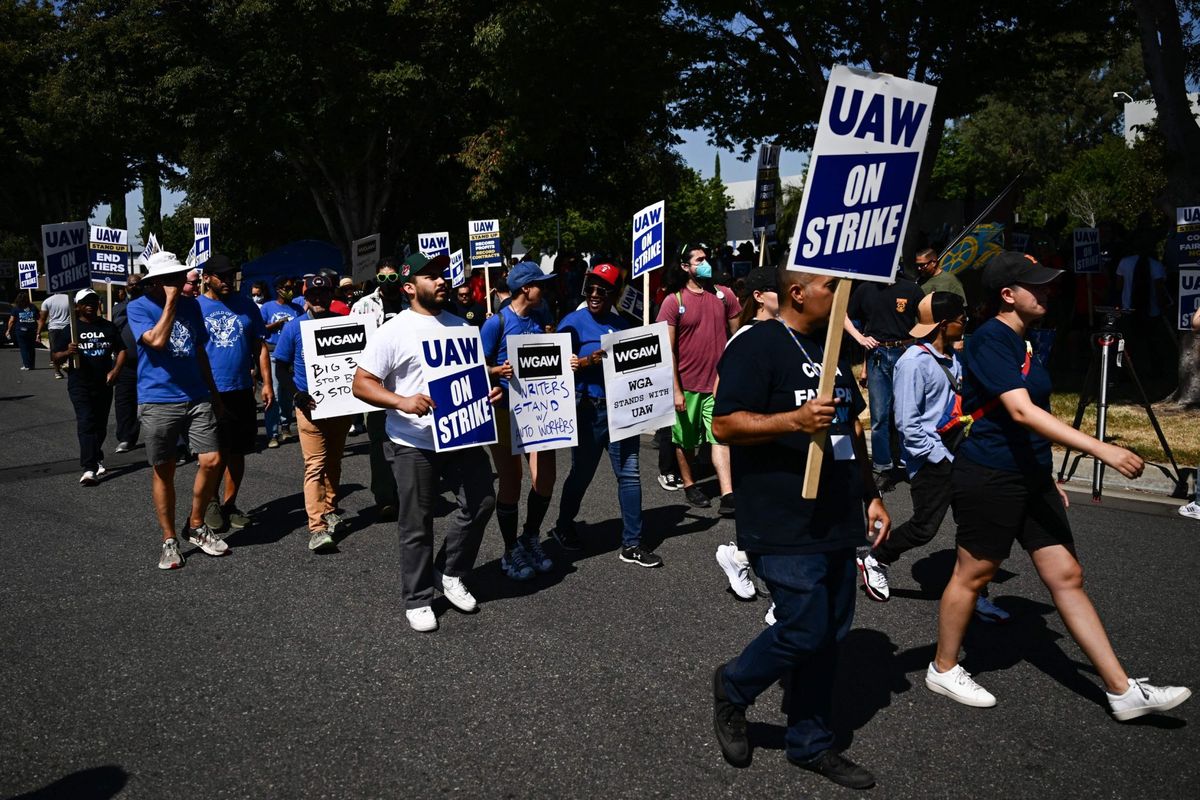 GM and Stellantis are nearing a tentative contract with autoworkers and ending a costly six-week strike after agreeing to a 25% pay hike 1 e6bd2bd1 GettyImages 1690721104 e1698450903597