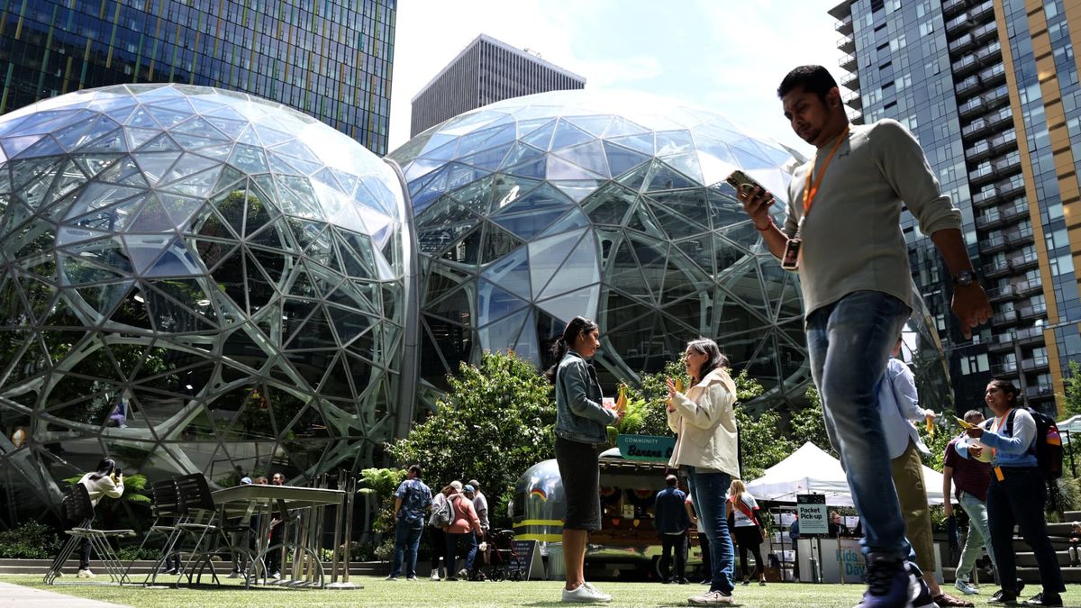 Amazon laying off about 14,000 corporate workers as it invests more in AI