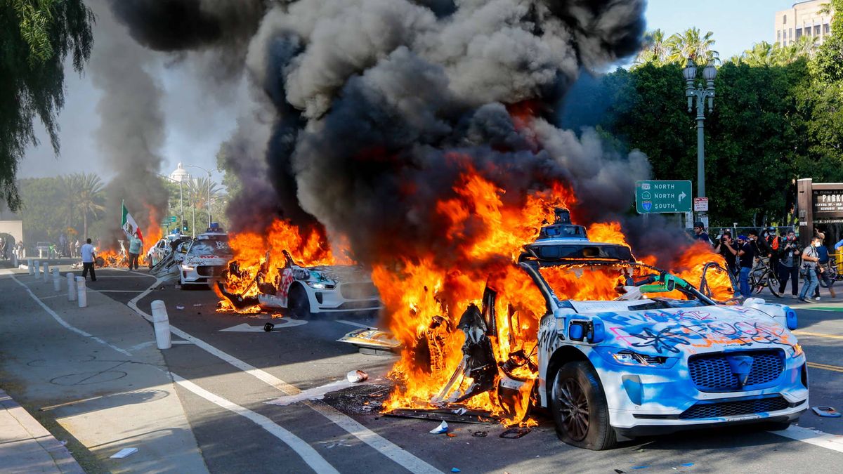 Photos show Waymo vehicles on fire during LA protests as company cuts downtown service