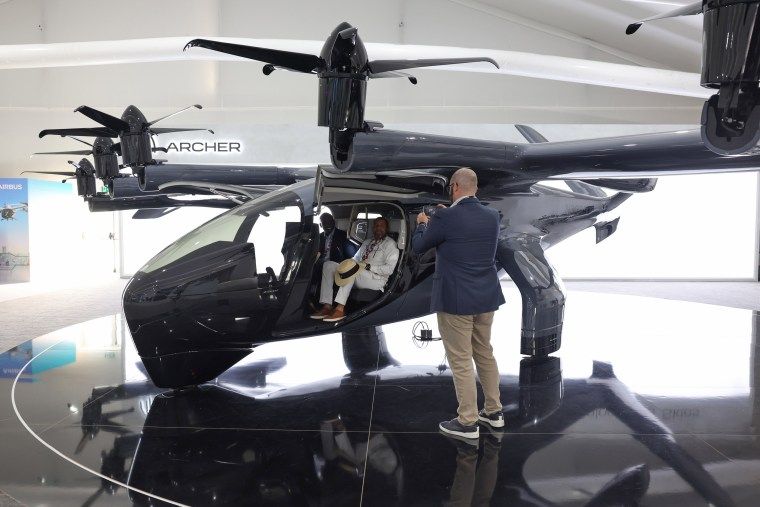 Electric air taxi maker Archer Aviation gets key FAA sign-off 1 Visitors to the 2023 Dubai Air Show sit inside an Archer Aviation Midnight aircraft.