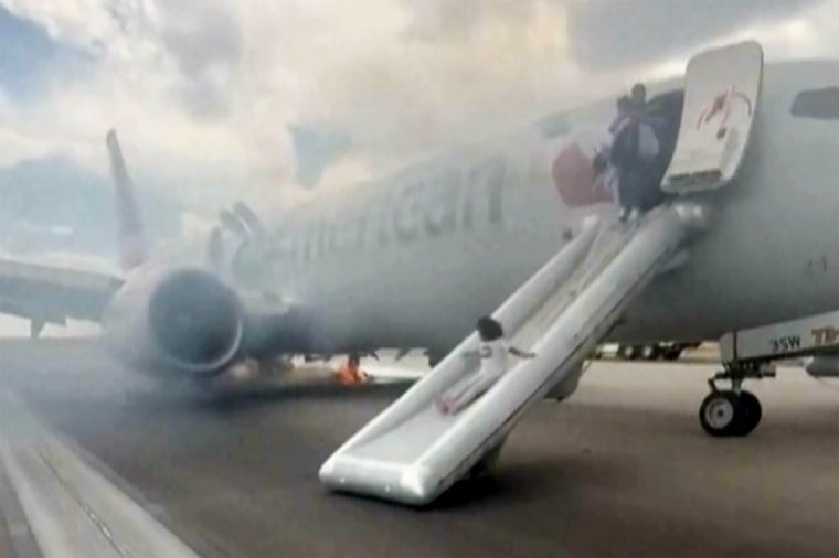 FAA instructs airlines to re-evaluate evacuation procedures 1 Passengers evacuating an American Airlines jet at Denver International Airport on emergency slides in July.