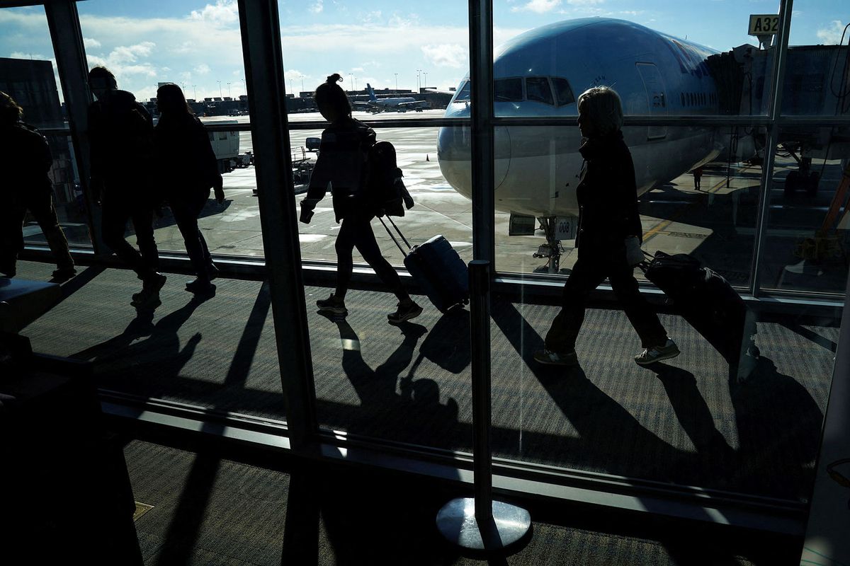 Biden signs sweeping aviation safety, reform bill into law 1 7177141e 516 washington dulles intl airport silhouette travelers 2023 ac 1132p a8ce33