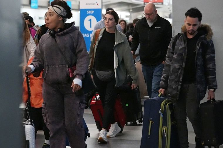 FAA freezes flight cancellations at 6% as government shutdown ends 1 Travelers walk though the terminal at O'Hare International Airport in Chicago, Wednesday, Nov. 12, 2025.