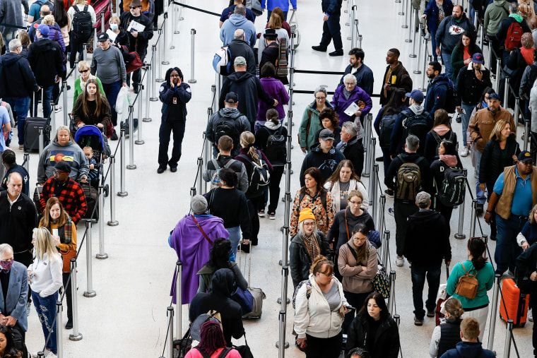 Image: A TSA agent directs passengers   on Nov. 21, 2022, in Kenner, La. 
