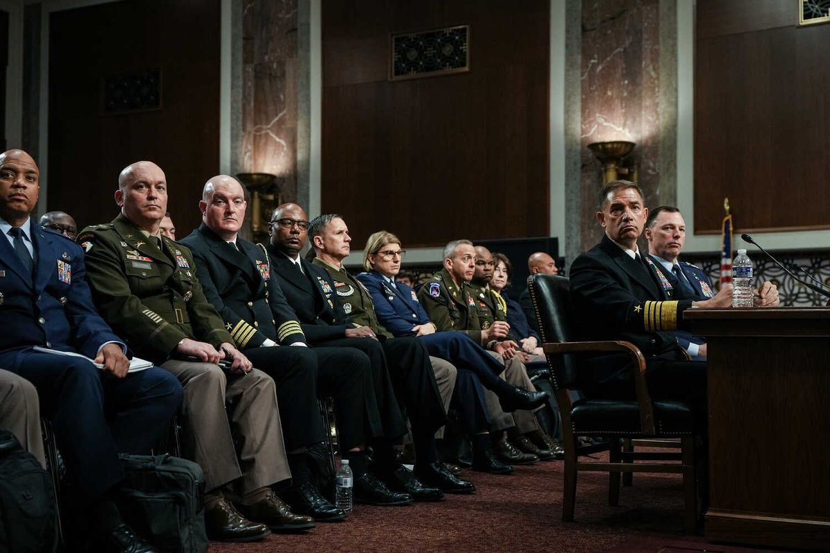 Video: Top U.S. Commander Dismisses Reports of Civilian Deaths in Iran 1 Mr. Cooper and Mr. Anderson sit at a desk while various members of the U.S. military sit behind them.