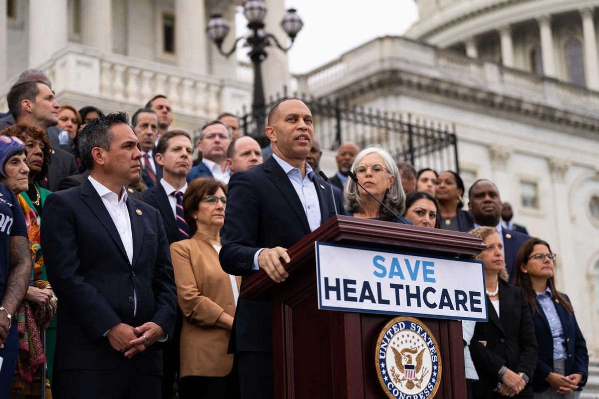 Video: Republicans and Democrats Trade Blame as Shutdown Looms 1 Representative Hakeem Jeffries, wearing a dark jacket, stands with a group of lawmakers in front of the Capitol at a lectern bearing a sign with the words “Save Healthcare.”