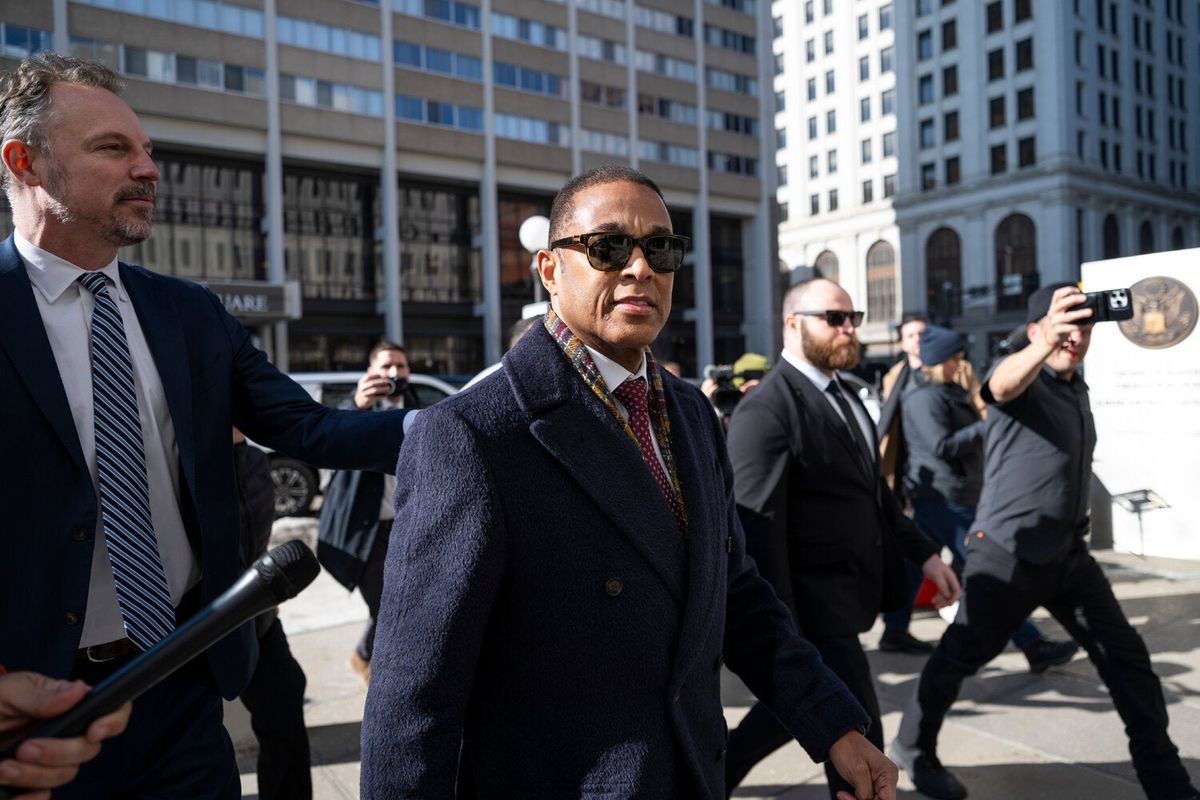 Video: ‘I Will Not Back Down’: Don Lemon Enters Not Guilty Plea 1 Don Lemon, in a tie and coat, walks on a street surrounded by others.
